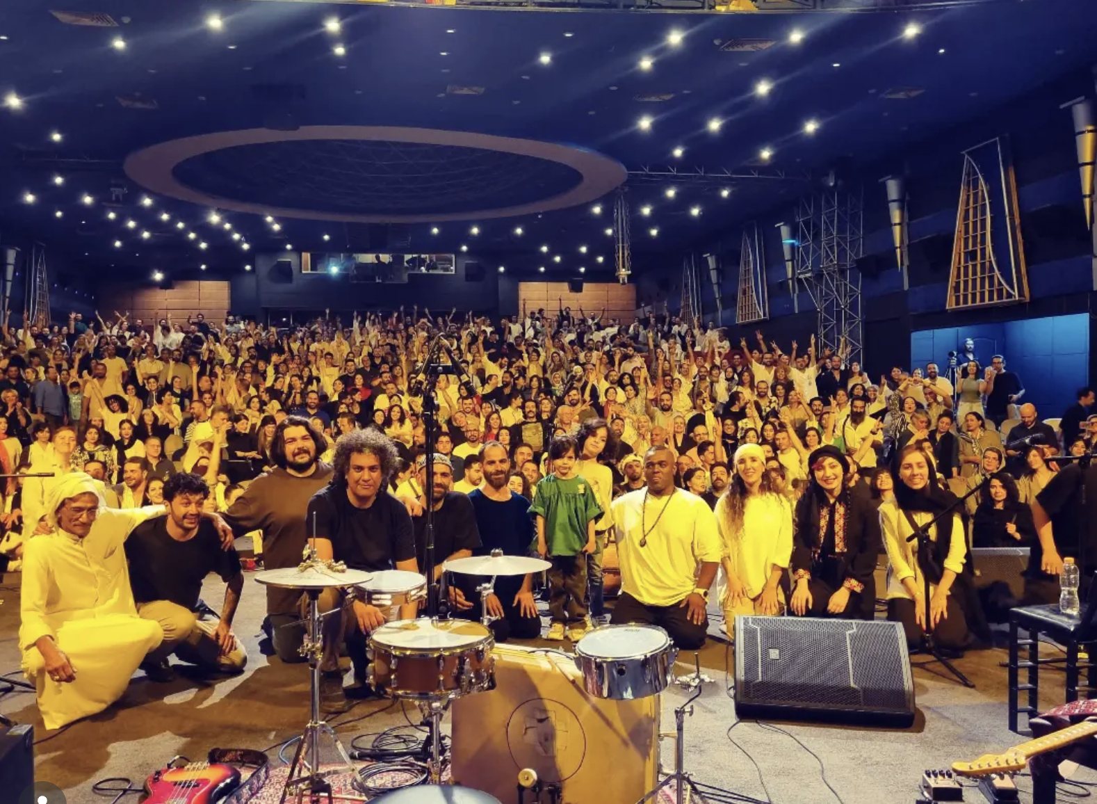 Kamakan and a packed audience at a live concert